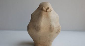 This Woodcarver Carves Figures And Objects As If They Are Trapped Within Wooden Fabric