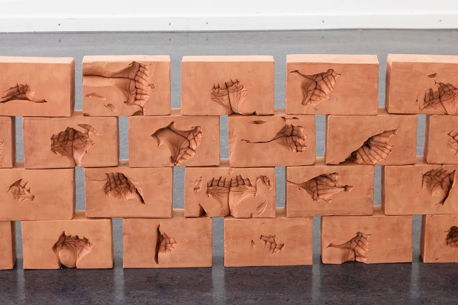 Danish Artist Creates Sculpture Of Hand Impressions On Clay As Memorial For His Departed Father